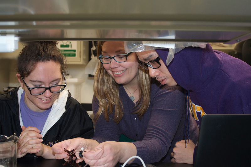 Professor and students in lab