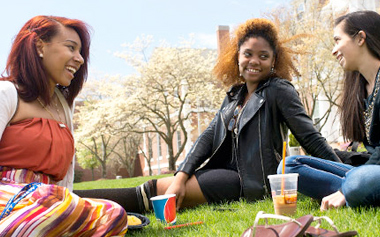Students sitting in grass