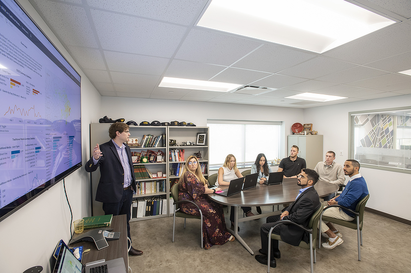 Teacher teaching students in classroom