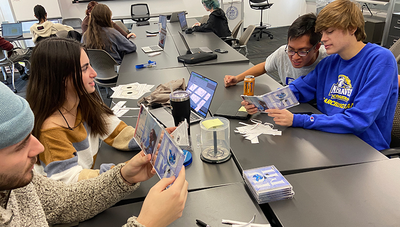 Students assembling CDs