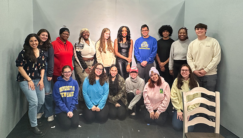 Ayminor (back row, center) with Chargers in the University’s television studio.