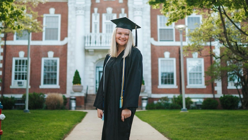 Bradyn Van Sant ’22 in front of Maxcy Hall at the University.