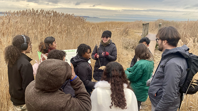Amy Carlile, Ph.D. guiding students through the Long Wharf Nature Preserve.