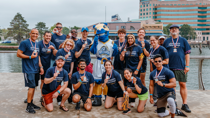 Charlie’s Chargers celebrate their third-place finish and Spirit Award win at the 8th Annual Dragon Boat Regatta.
