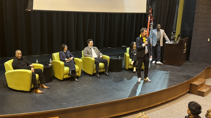 Jens Frederiksen with panel on stage