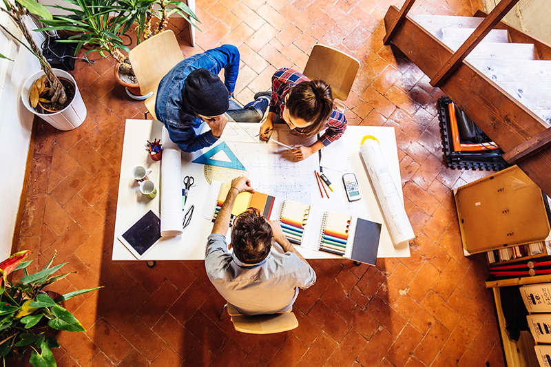 An overhead shot of designers looking at swatches.