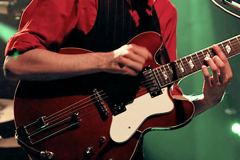 Close-up of person playing guitar