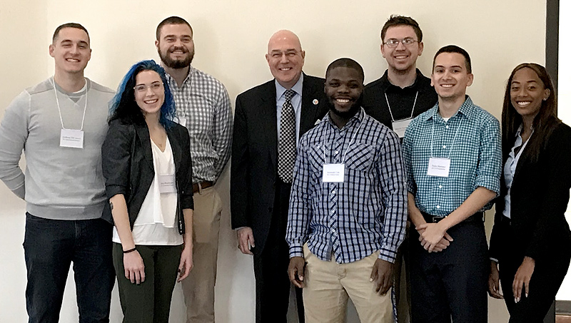 Image of Larry Bingaman ’96 EMBA and students.