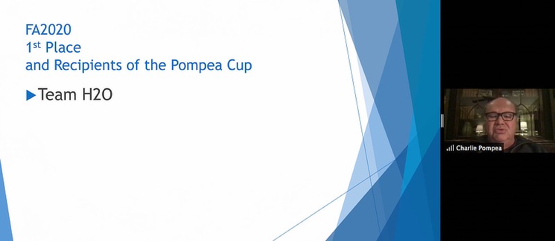 Image of Charles Pompea /U+0026#x27;71, /U+0026#x27;90 EMBA, /U+0026#x27;06 Hon. annoucning the winner of the expo.