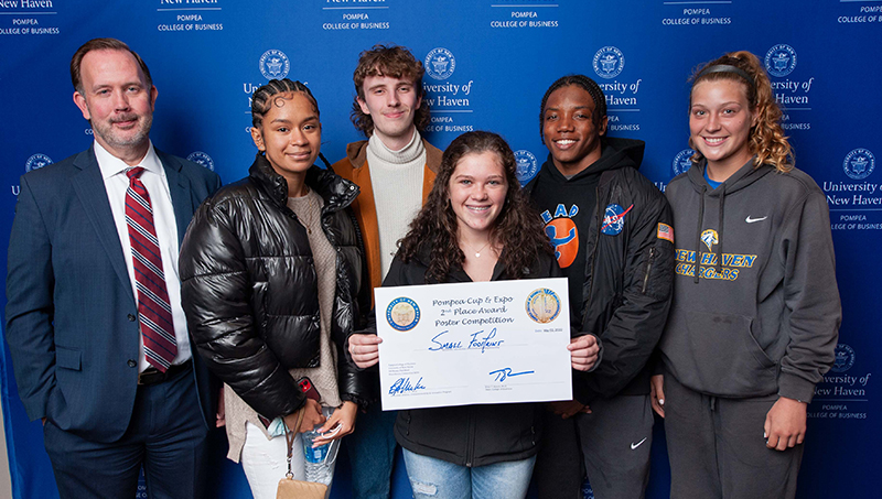 Dean Brian Kench, Ph.D. (left), and the team of students that developed “Small Footprint.”