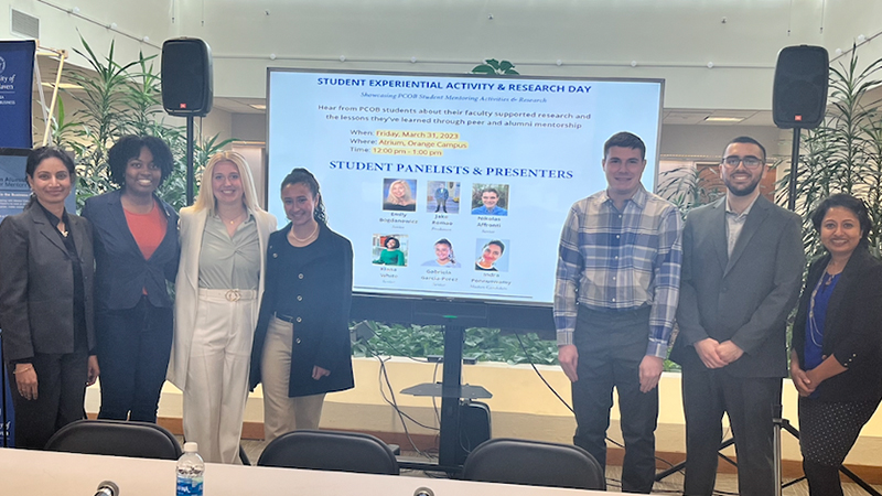 Jestine Philip, Ph.D. (far right), with student panelists and presenters at the event.