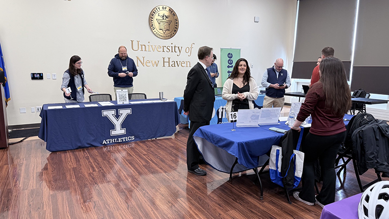 People interact at the University of New Haven's Sports Industry Career Fair.