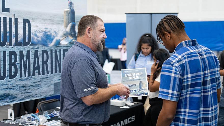 A student speaks with a representative of a prospective employer at the Career Development Center's annual career fair.