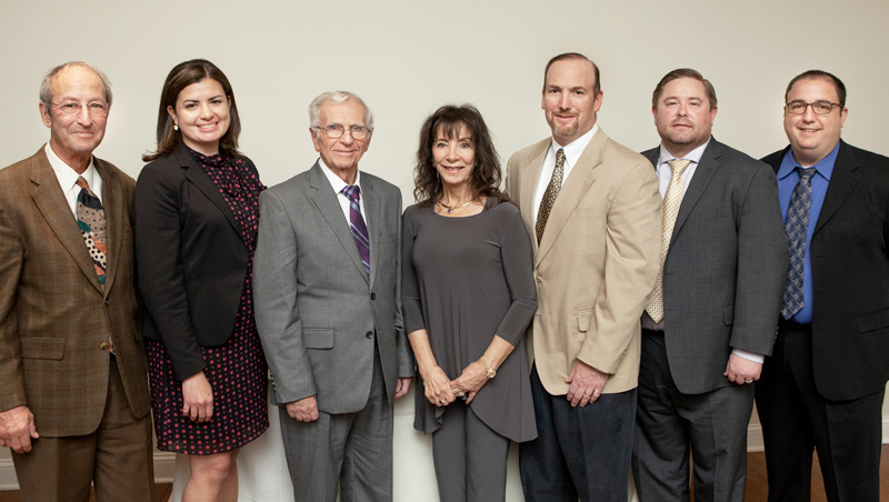 Group photo of President Steve Kaplan; Carolina Ramirez-Blier ’09; Nicholas Squeglia ’60 A.S., ’63 A.S.; Jean O’Brien (wife of William (Bill) O’Brien ’64; Sean O’Brien (Son of William (Bill) O’Brien ’64; Cory Hall (MITRE); Mark Guido (MITRE); Tagliatela College of Engineering Dean Ron Harichandran; and Provost Daniel May.