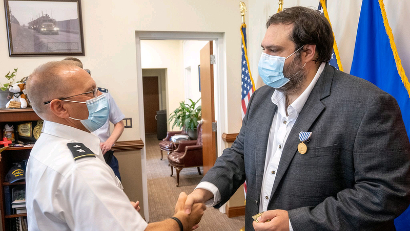 Ibrahim Baggili, Ph.D., is presented the Civilian Medal of Merit.