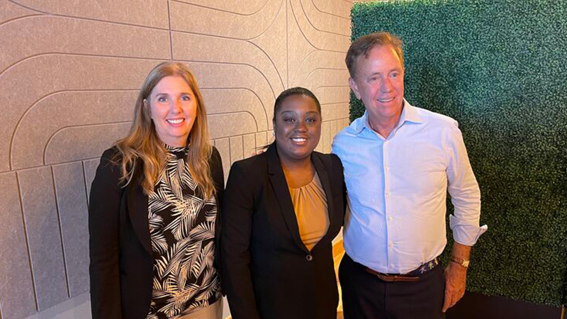 Left to right:  Dr. Kelli-Marie Vallieres, vice chair of the Governor’s Workforce Council; Fredlyne Antoine ’24; and Gov. Ned Lamont. 