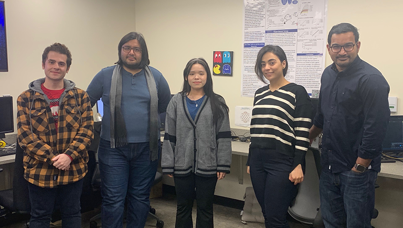Left to right: Arshad Badfar ’25 M.S., Dr. Vahid Behzadan, Nancirose Piazza ’24 Ph.D., Bahareh Arghavani ’24 M.S., and Binesh Sadanandan ’27 Ph.D. in the SAIL lab space.