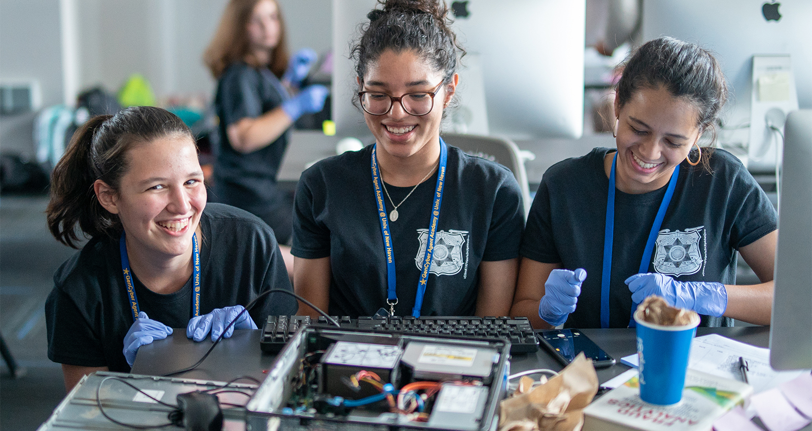 Three female students laughing.