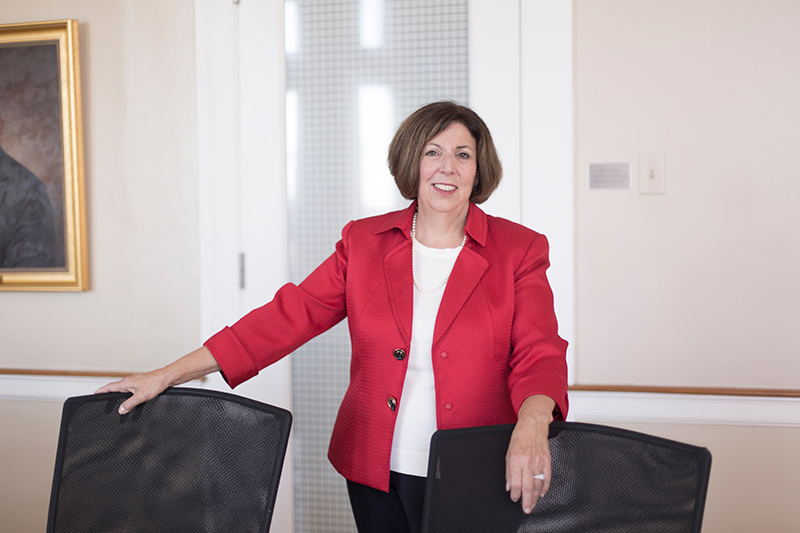 Healthcare executive smiles.
