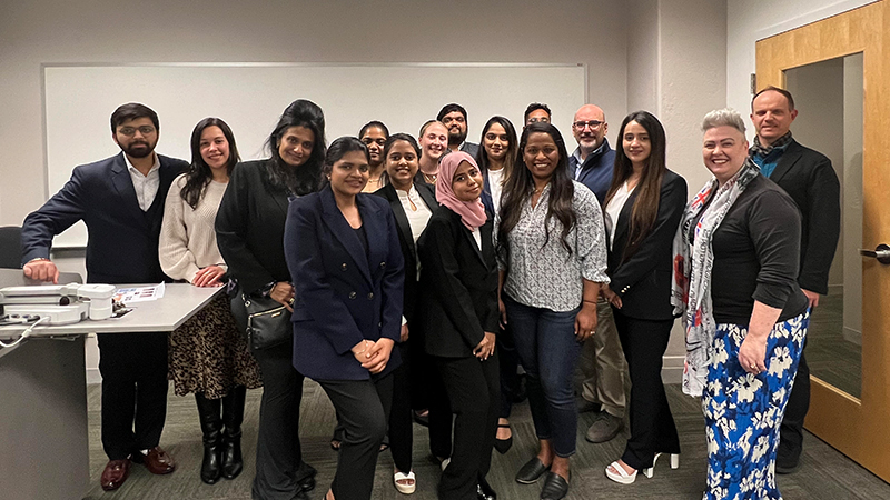 Student panelists and judges pose for a phoot.