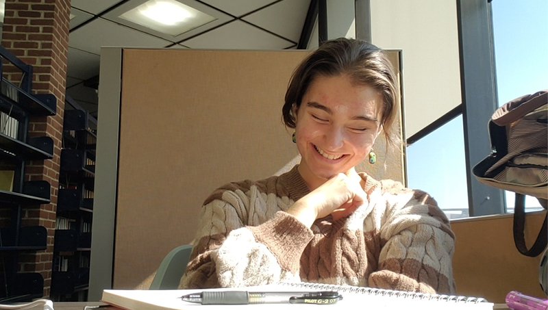 Beatrice Glaviano ’26 in the University’s Peterson Library.