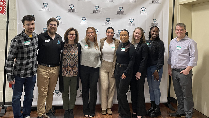 Several members of the University’s School of Health Sciences pose for a photo side by side.