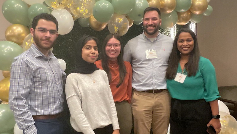 Left to right: Jose Perez MHA, Hiba Jaidi ’25 MHA, Maria Latta ’24 MHA, Prof. Jordan Schweidenback, and Dr. Reena Kelly.