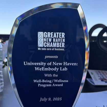 Award reading "Greater New Haven Chamber, we take care of business. presents University of New Haven WeEmbody Lab with the Well-Being / Wellness Program Award, July 9, 2025."