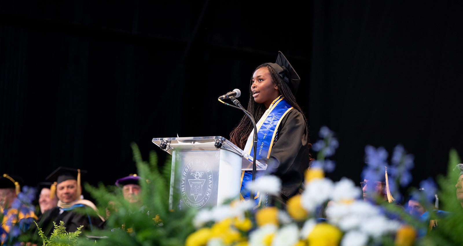 Student speaking at commencement