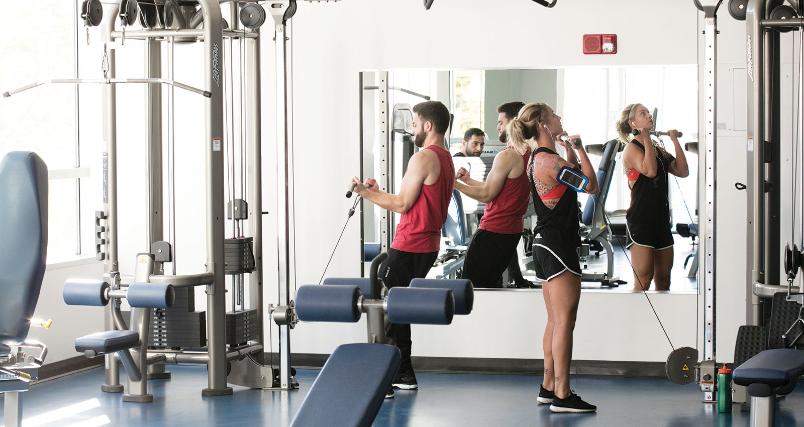 Students working out in a gym.