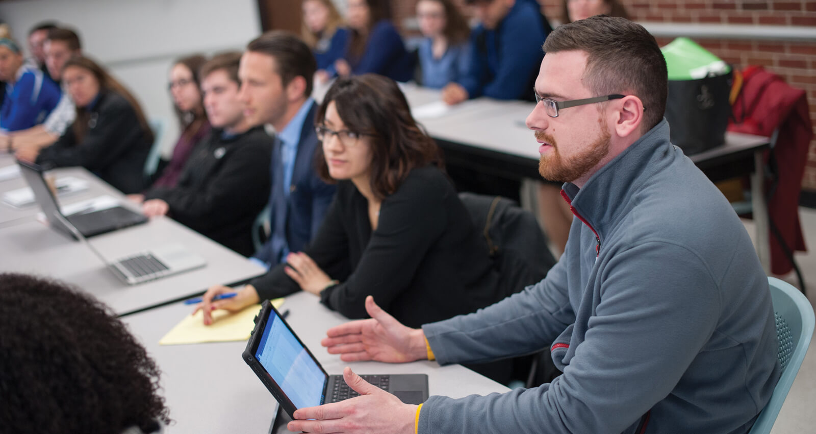 Male student speaks in class