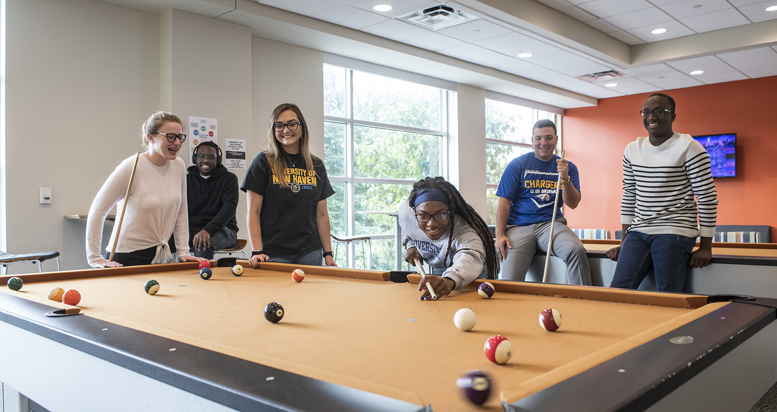 Students playing pool in residence hall