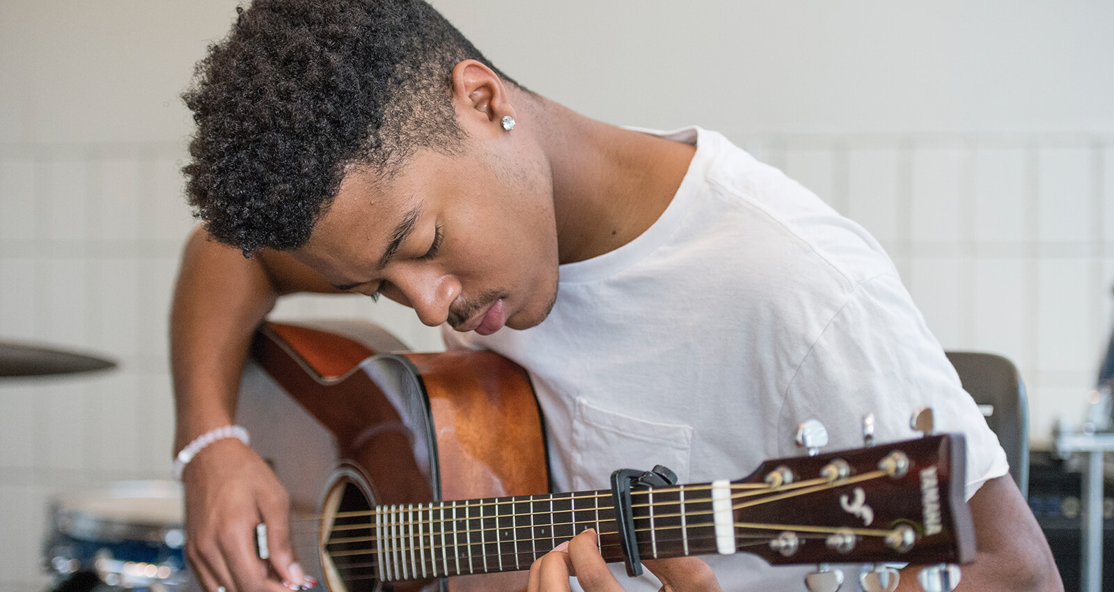 Student playing guitar
