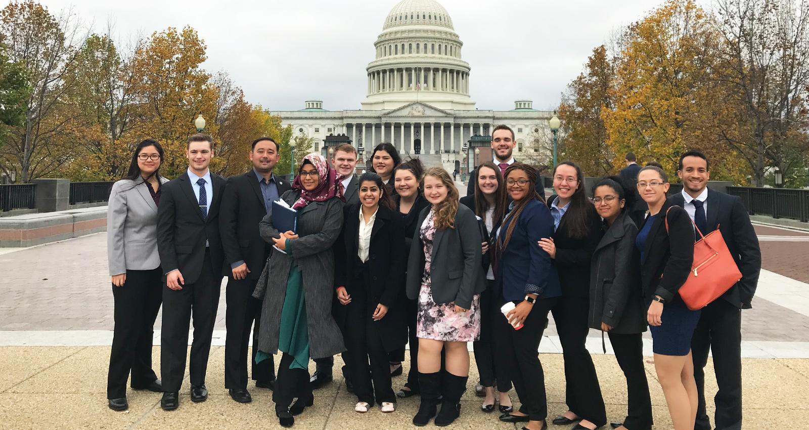 Group standing in front of White House