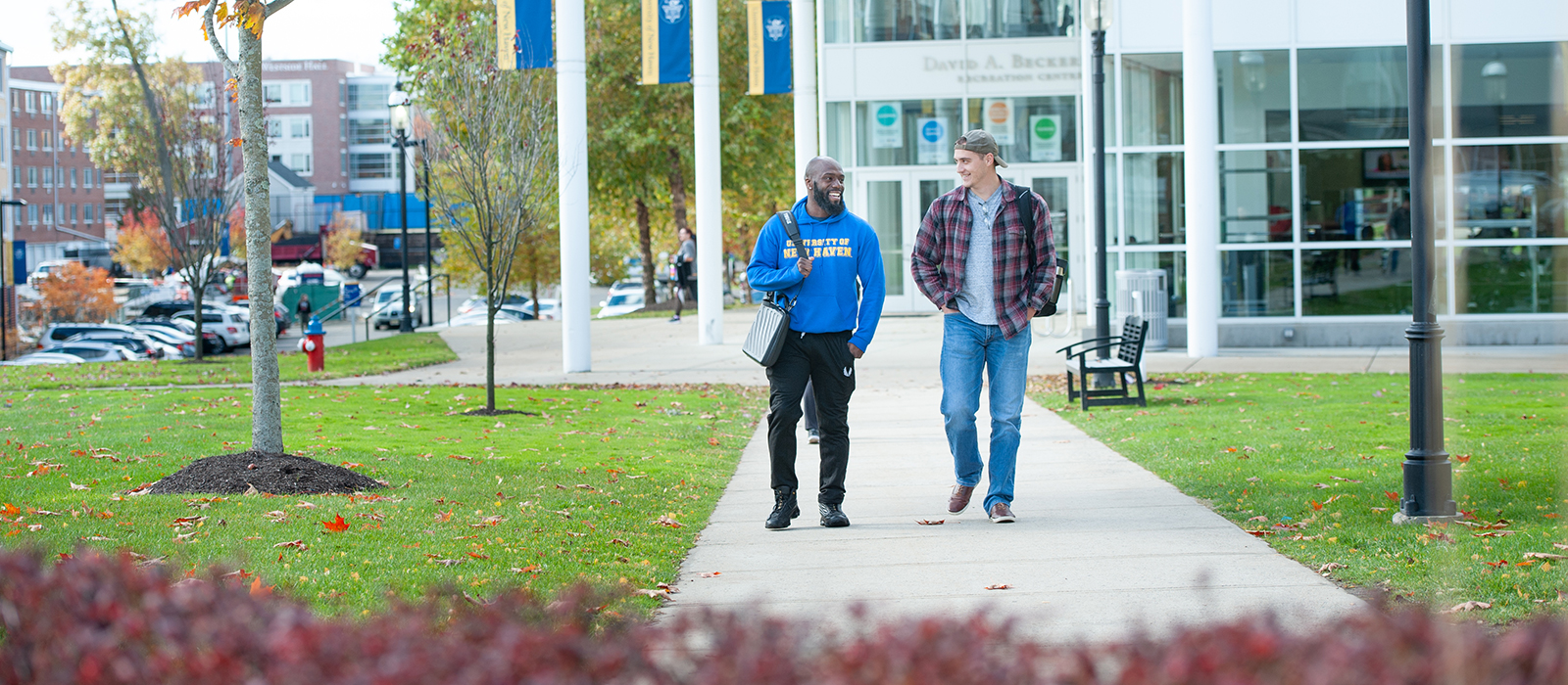 Two veteran students walking on campus.