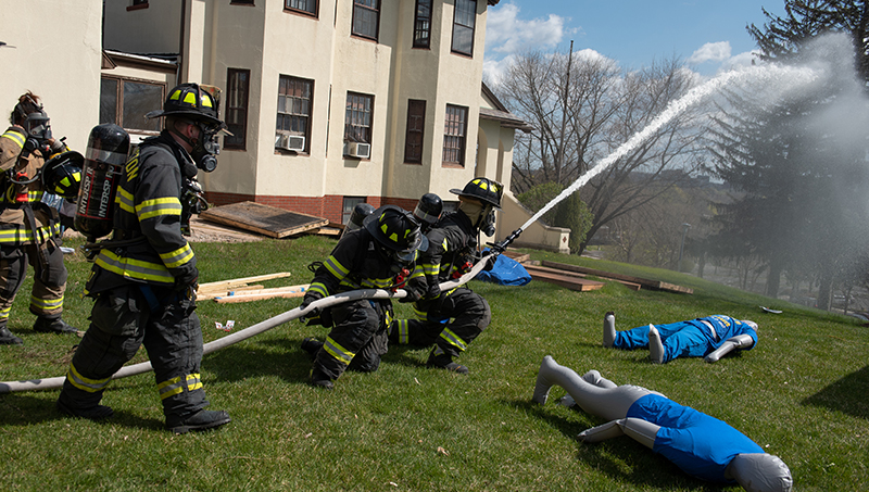 Fire science students respond to the mock incident.