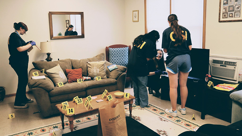 At the University’s CSI house, students investigated mock crime scenes.