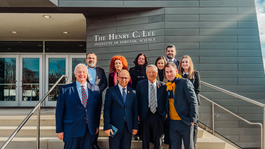 President Jens Frederiksen, Dr. Henry C. Lee and Dr. Mario Gaboury with a contingent from the University of Tirana in Albania.