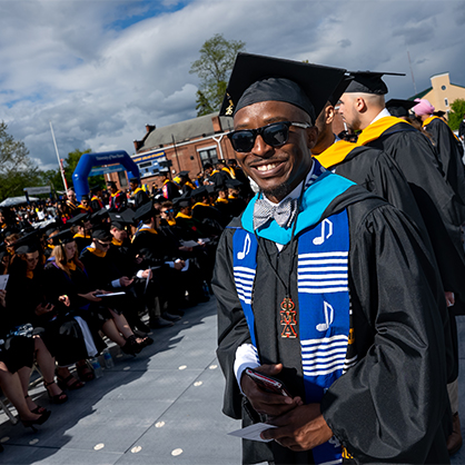 Even though graduates and guests had to dodge some rain drops, it was a joyous and memorable celebration at the University's Kathy Zolad Stadium.
