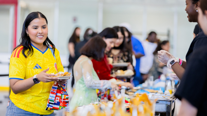 Attendees sample a variety of international dishes