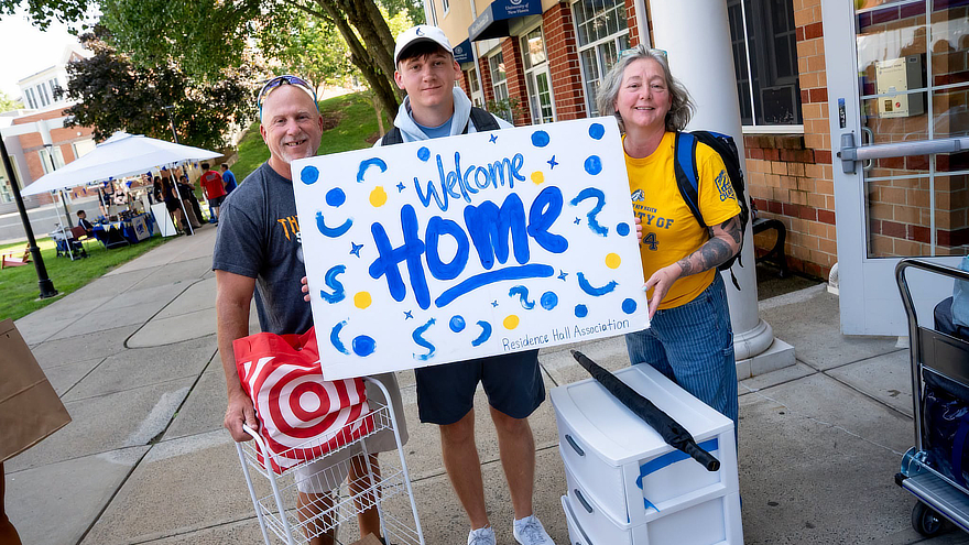 A family celebrates a new beginning as their Charger arrives on campus.