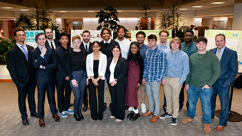 Interim President Sheahon Zenger, Ph.D. (far right), and students at the competition.