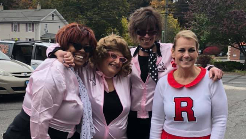 Four people dressed up for Halloween.