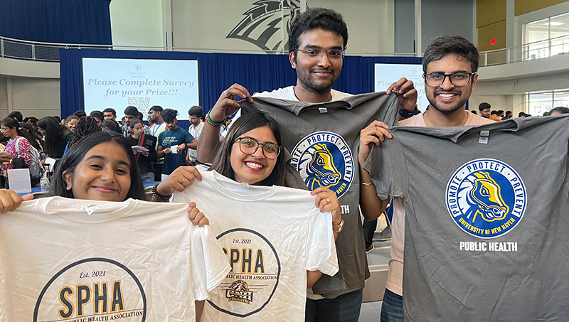 Vishwa Shah ’24 MPH (second from left) and her fellow Chargers get charged up at orientation.