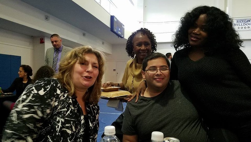 Image of Robert Velez at a holiday party with colleagues at the University.