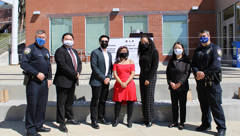 Professors and law enforcement pose for a photo.