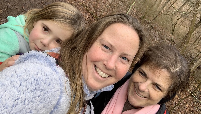 Paige Bartels (center) hiking with her sister and daughter.