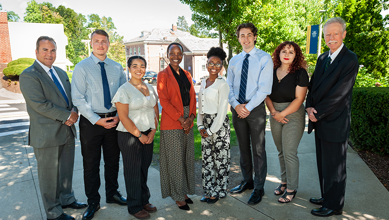 Left to right: Sheahon Zenger, Ph.D., Ian Boyce ’24, Delianne Ayala-Ramos ’24, Nora Augustine ’23 MHA, Tariyaha Morris ’23, Ryan Curry ’24, Nicole Miklinski ’23, and Philip H. Bartels ’11 Hon.