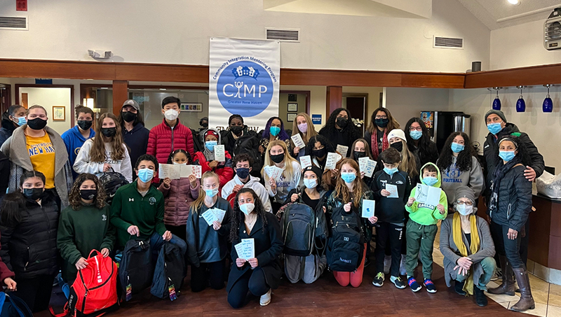 Group image of Gabriela Garcia-Perez ’24 (front, center) and her fellow volunteers.