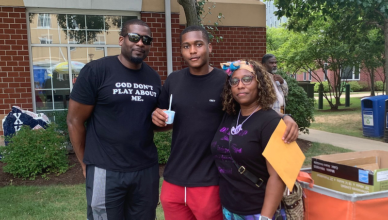 Jordan Paulin '26 and his parents.